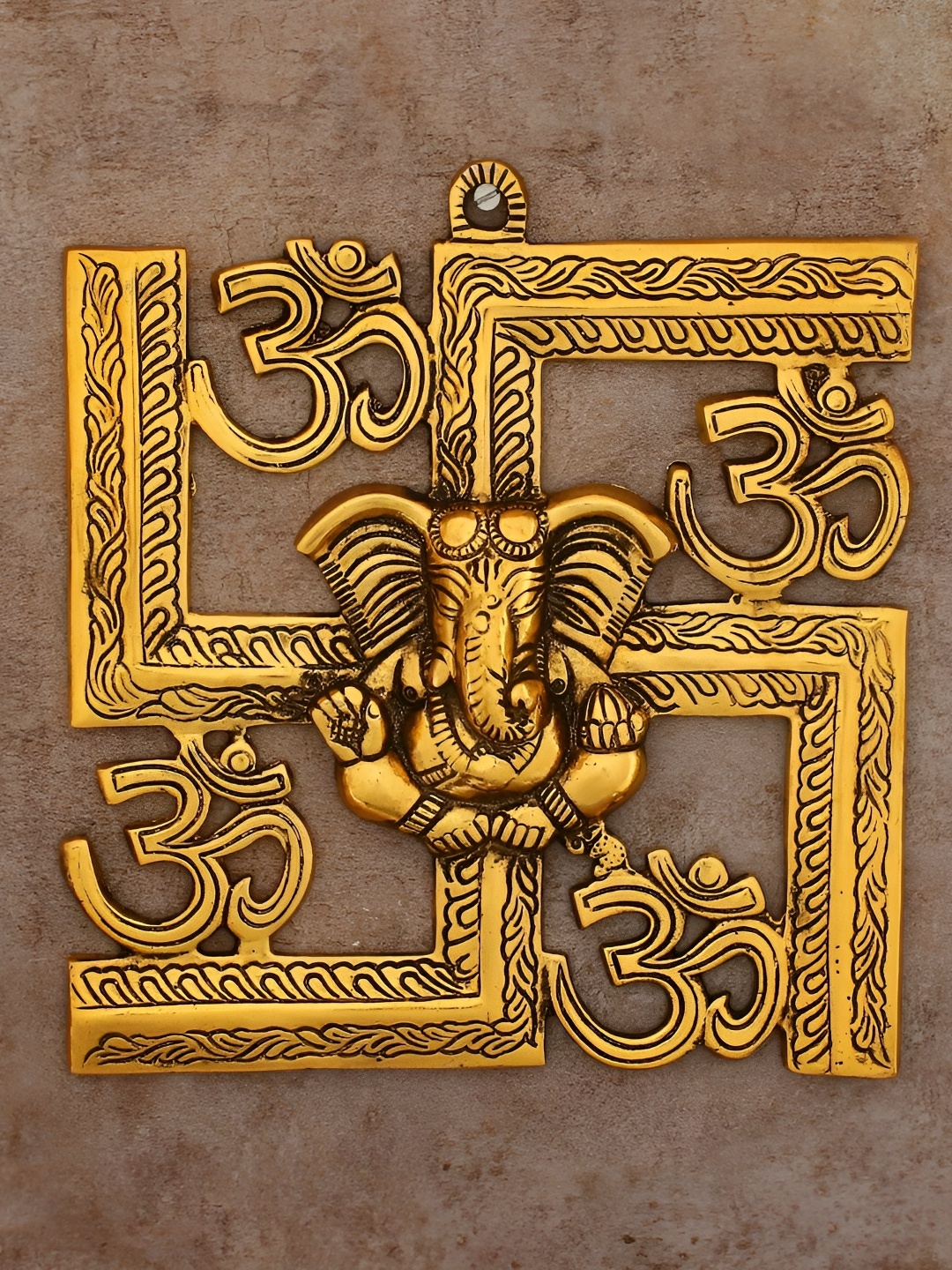 

PRANJALS HOUSE Brown Textured Metal Swastik Ganesh Wall Hanging, Gold