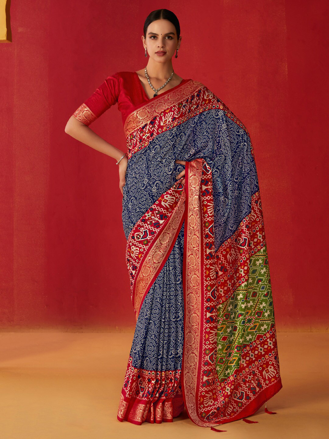 

Saree mall Navy Blue Ethnic Motifs Zari Patola Saree