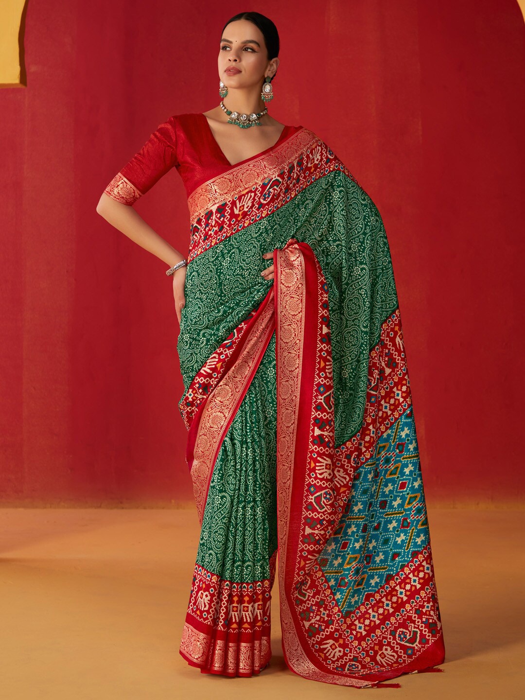 

Saree mall Green Ethnic Motifs Zari Patola Saree