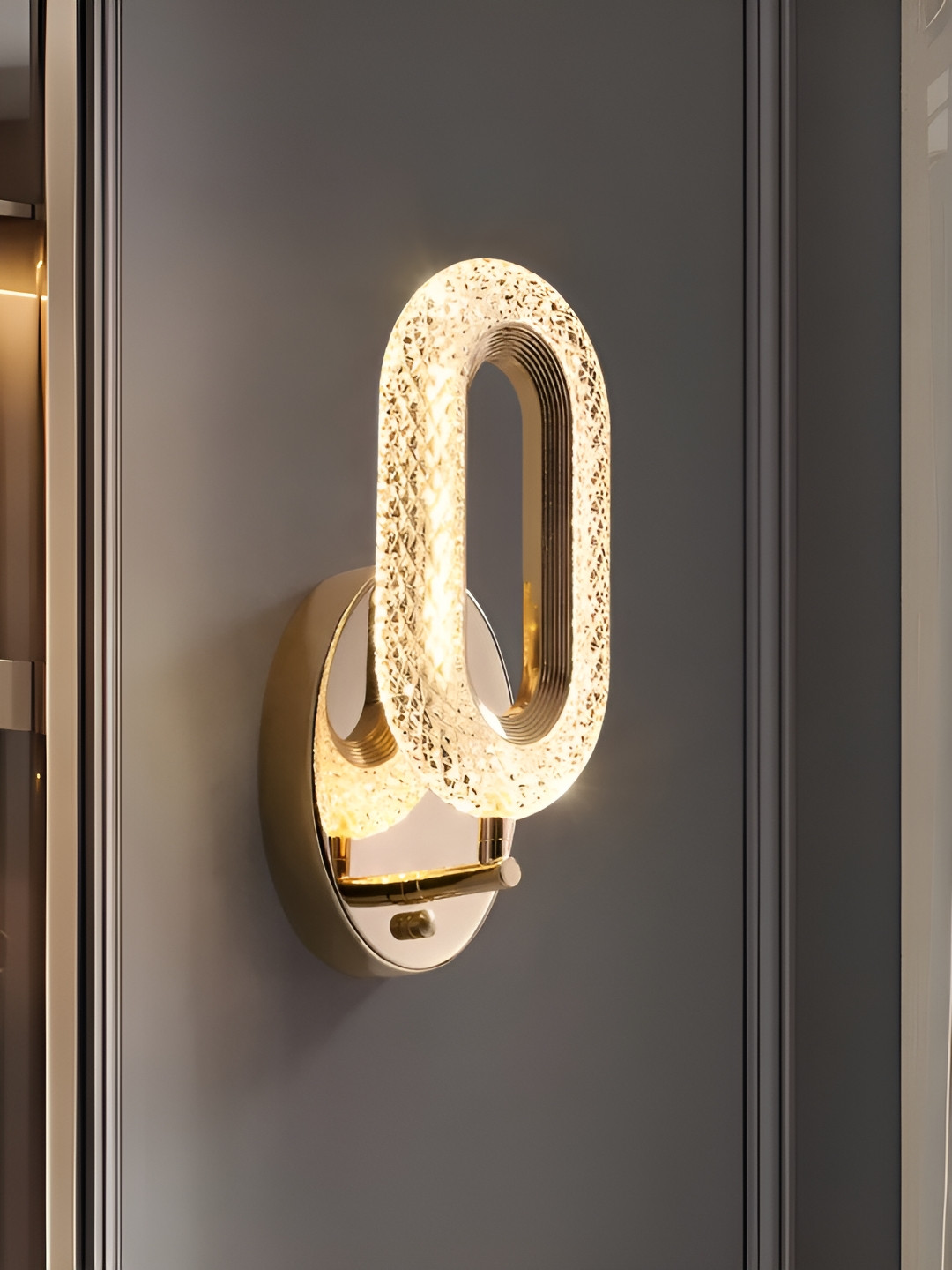

Whiteray Gold-Toned & White Textured Iron Contemporary Abstract Shaped Shaped Wall Lamp