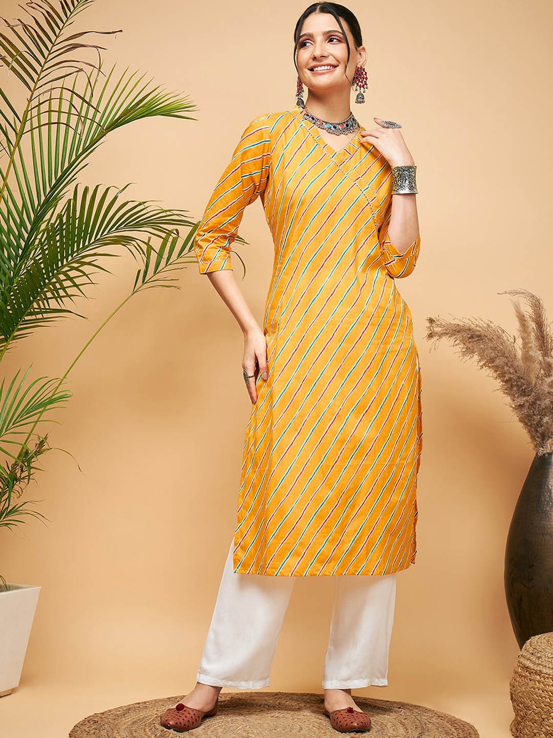 

InWeave Leheriya Printed V-Neck Gotta Patti Straight Kurta, Mustard