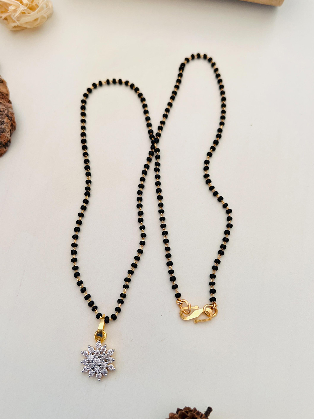 

Anouk Gold-Plated American Diamond Studded & Beaded Mangalsutra