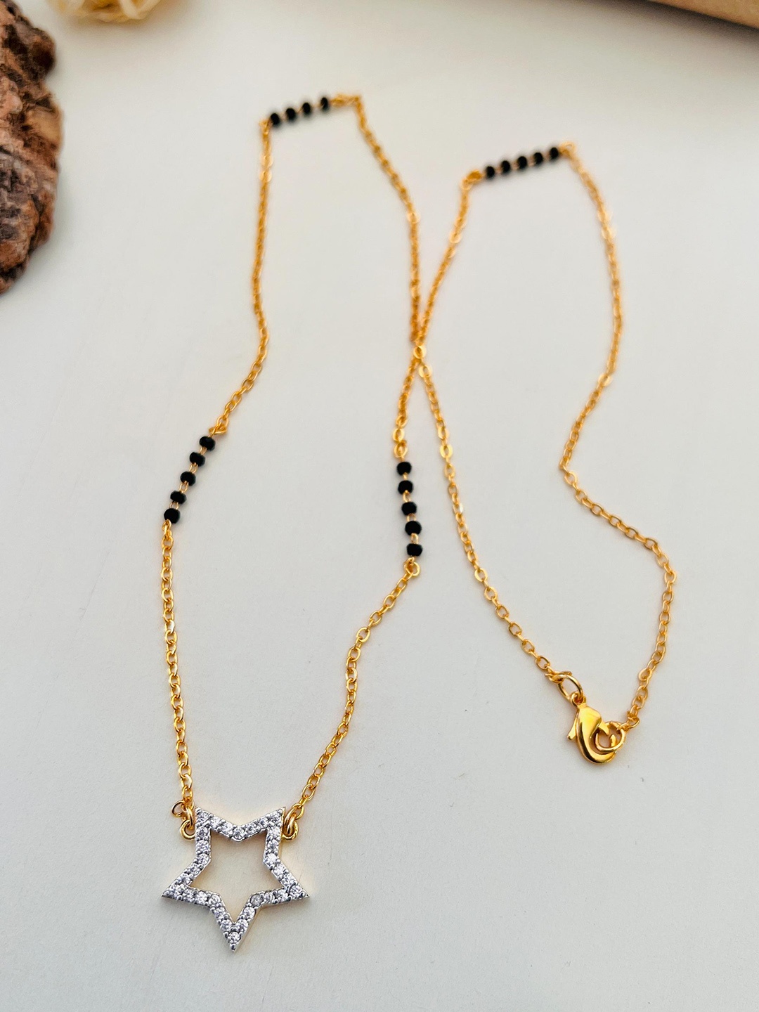 

Anouk Gold-Plated American Diamond Studded & Beaded Mangalsutra