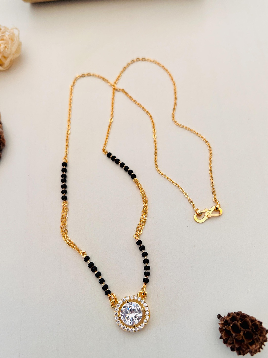 

Anouk Gold-Plated AD-Studded & Beaded Mangalsutra