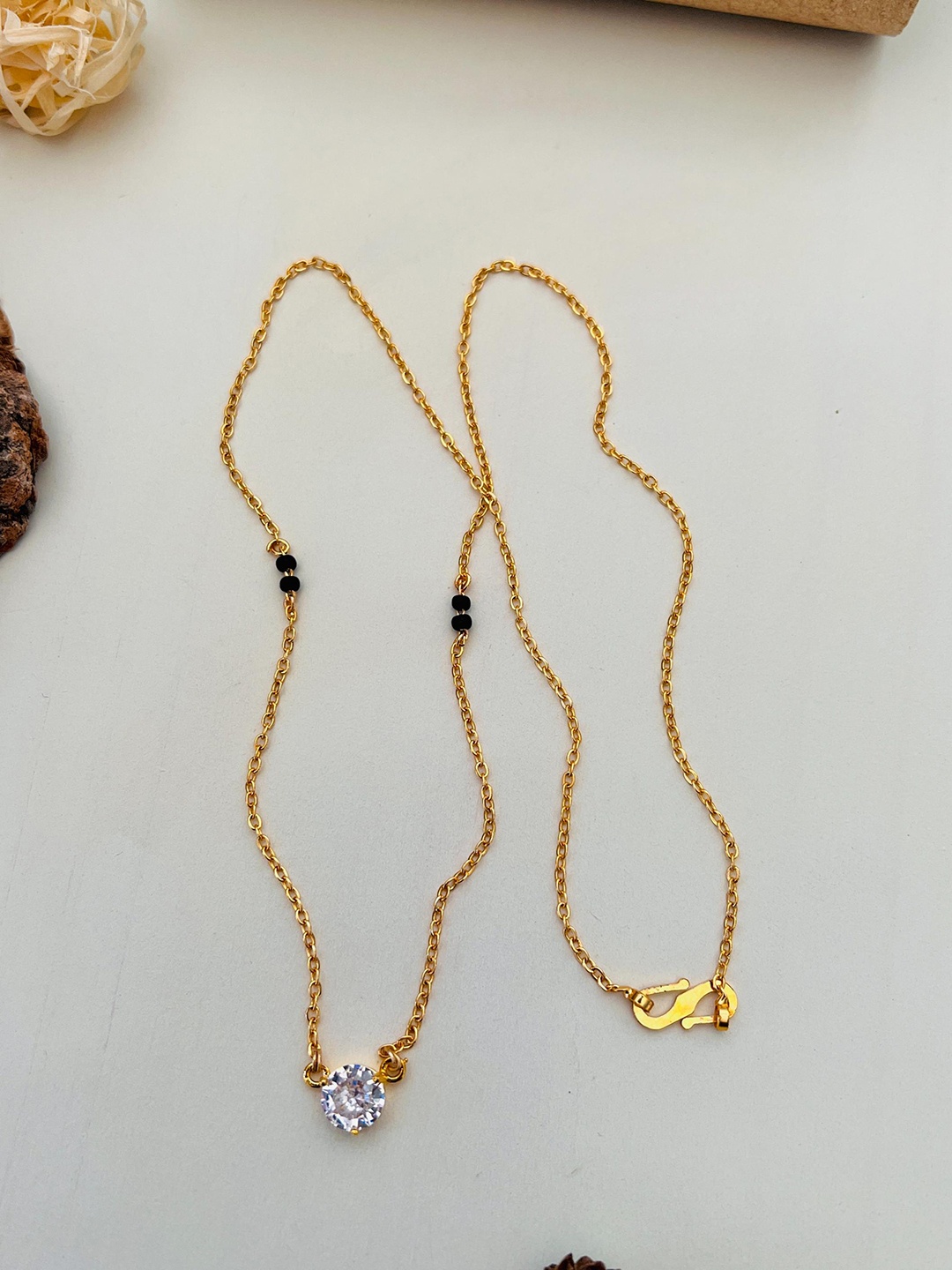 

Anouk Gold-Plated AD-Studded & Beaded Mangalsutra