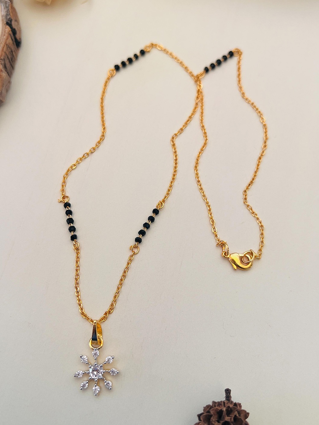 

Anouk Gold-Plated AD-Studded & Beaded Mangalsutra