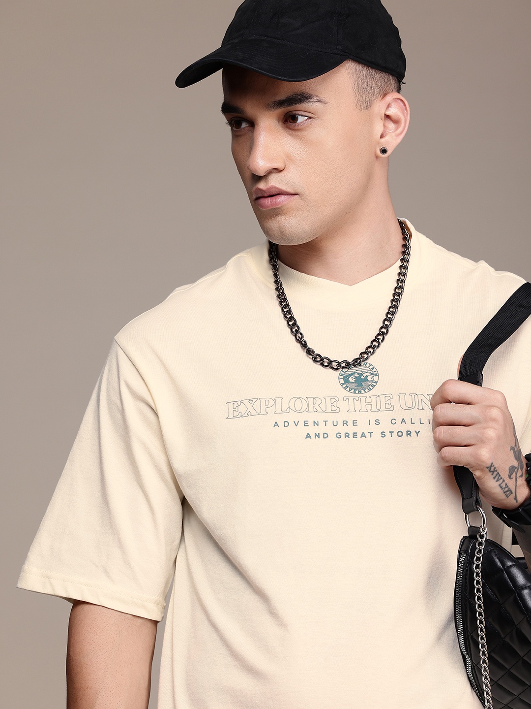

The Roadster Life Co. Typography Printed Drop-Shoulder Sleeves Oversized T-shirt, Cream