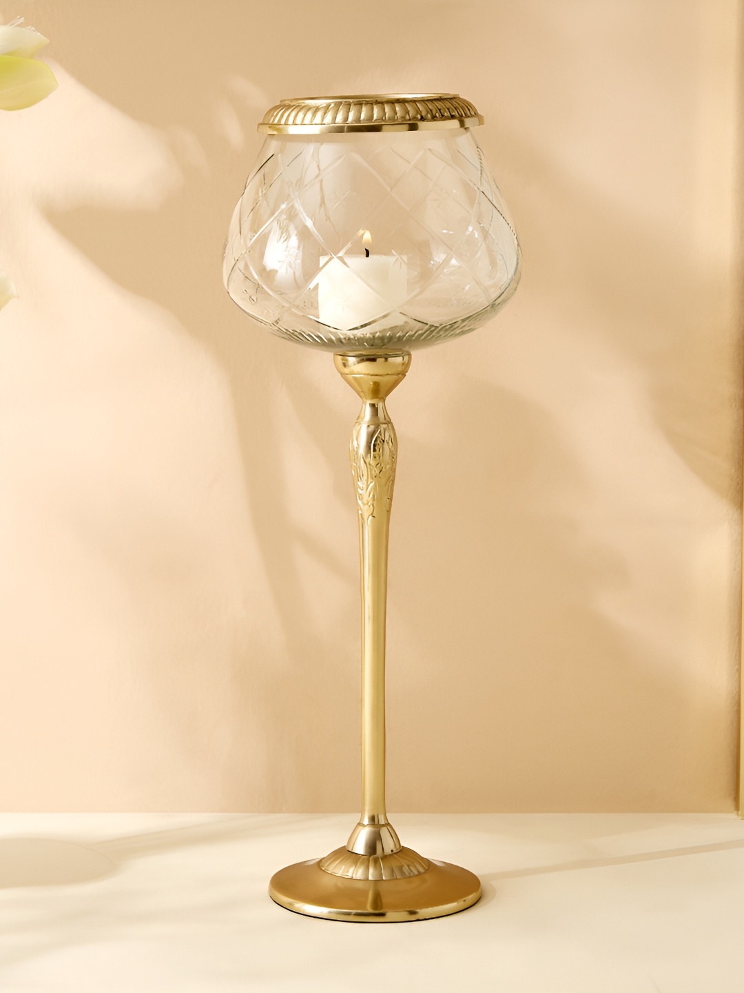 

Home Centre Transparent & Beige Glass Candle Holder