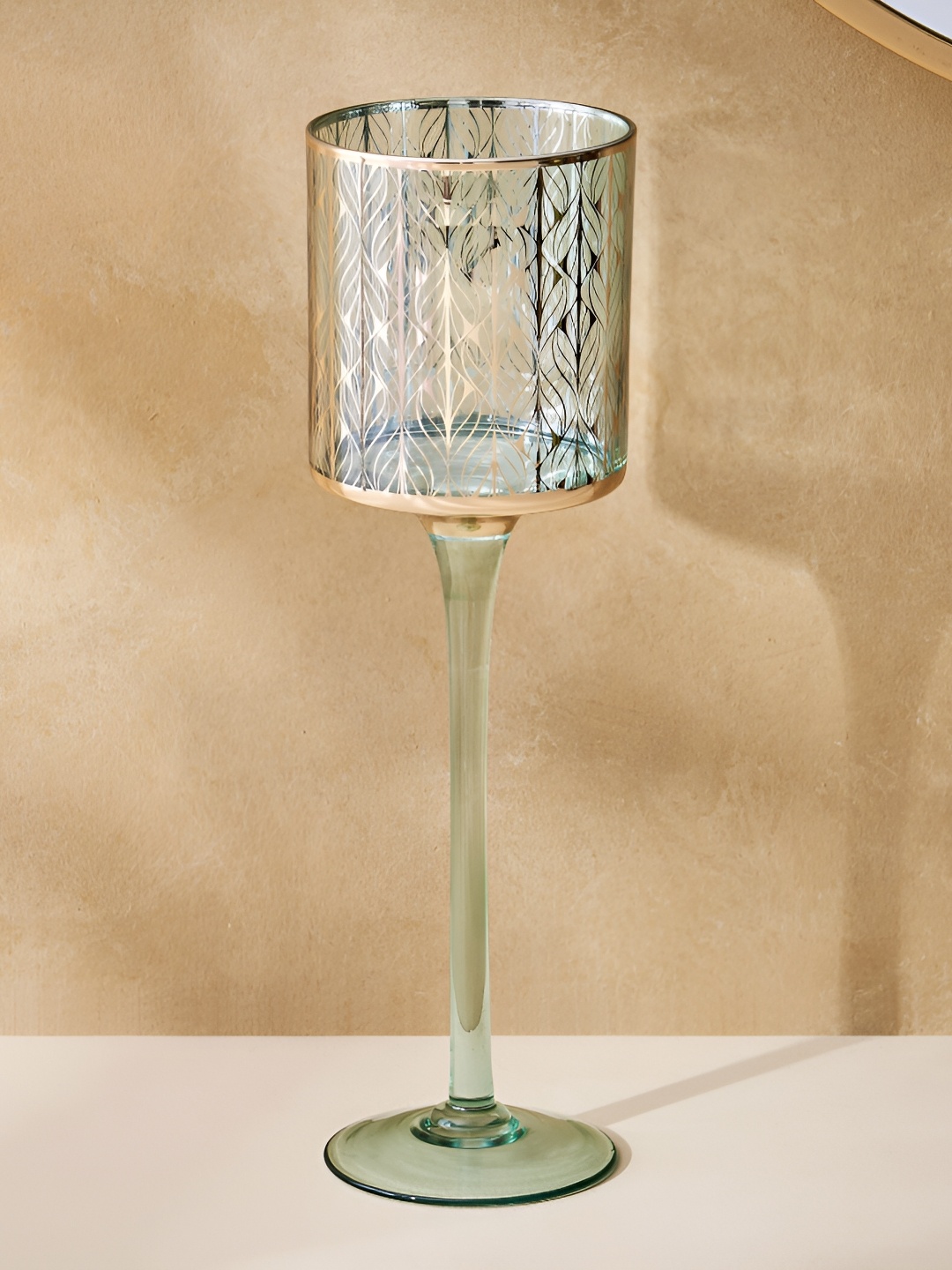 

Home Centre Green Glass Pedestal T-Light Holder