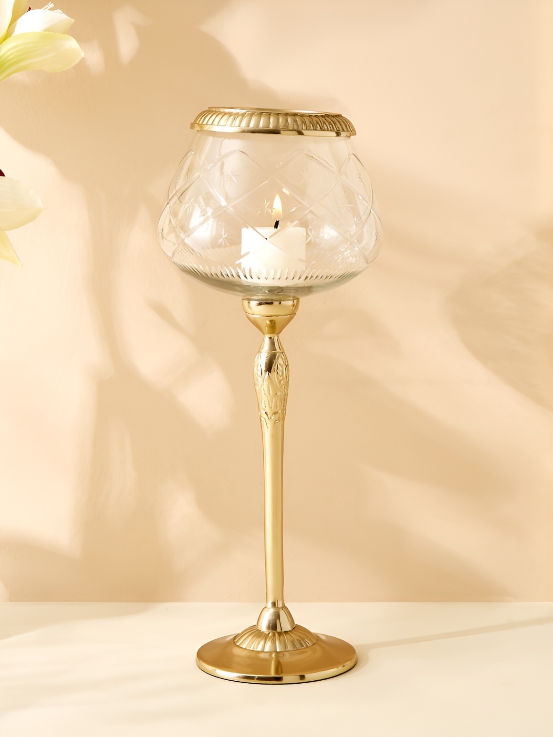 

Home Centre Transparent & Gold-Toned Glass Candle Holder