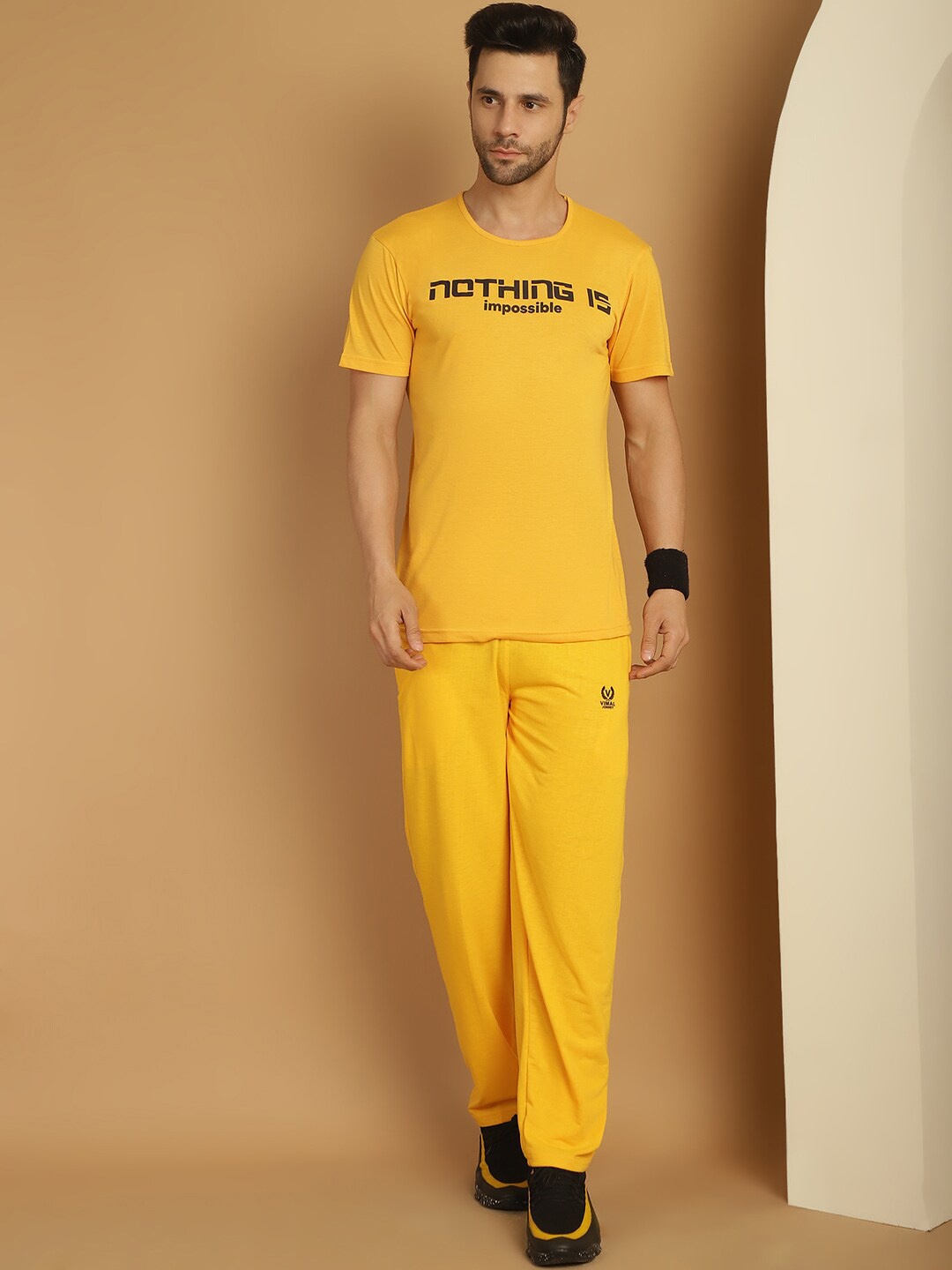 

VIMAL JONNEY Typography Printed Round Neck T-Shirt & Trousers, Yellow