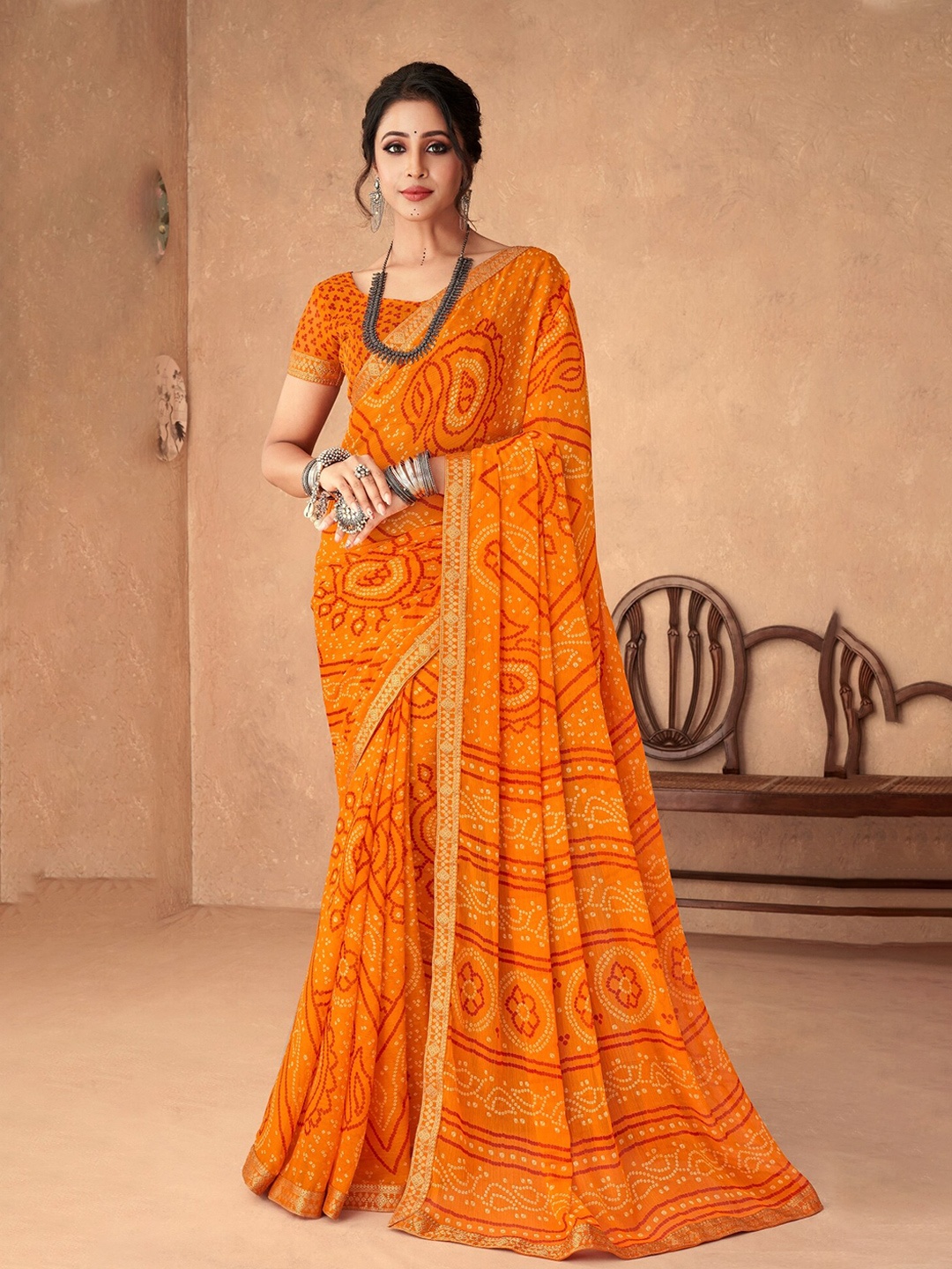 

Reboot Fashions Pure Chiffon Bandhani Saree, Mustard