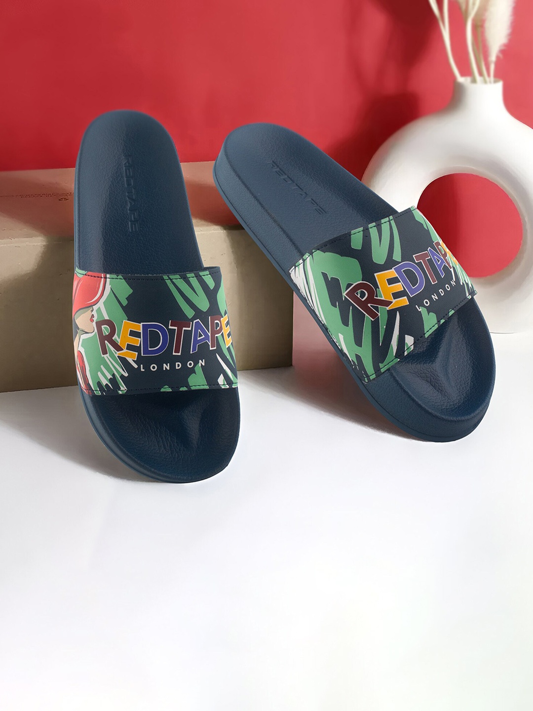 

Red Tape Women Printed Sliders, Navy blue