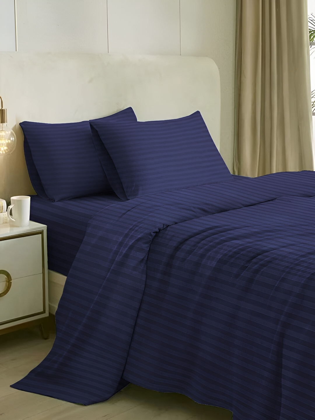 

Naksh Navy Blue Striped Cotton Fitted 210 TC King Bedsheet With 2 Pillow Covers