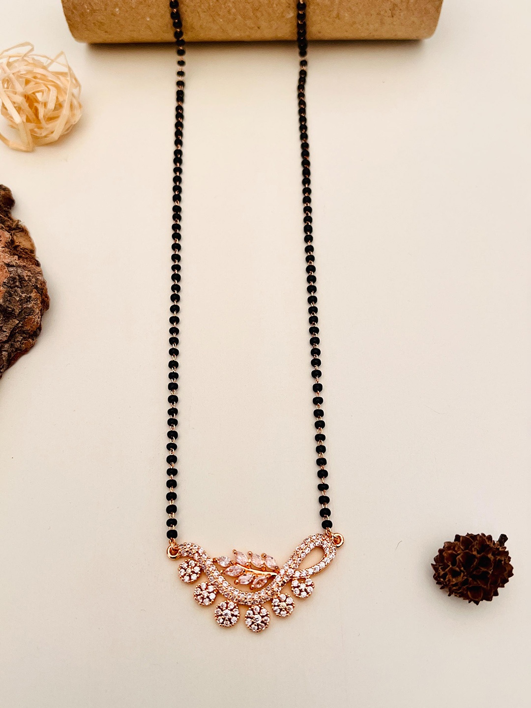 

Anouk Rose Gold Toned Rose Gold Plated American Diamond Studded & Beaded Mangalsutra