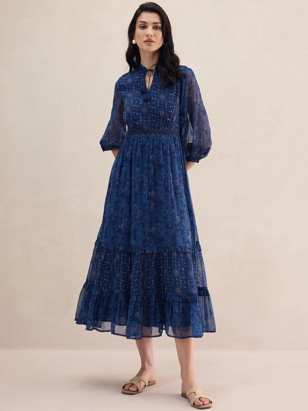 

FEMMELLA Ethnic Motifs Printed Tie-Up Puff Sleeves Tiered Midi Dress, Navy blue