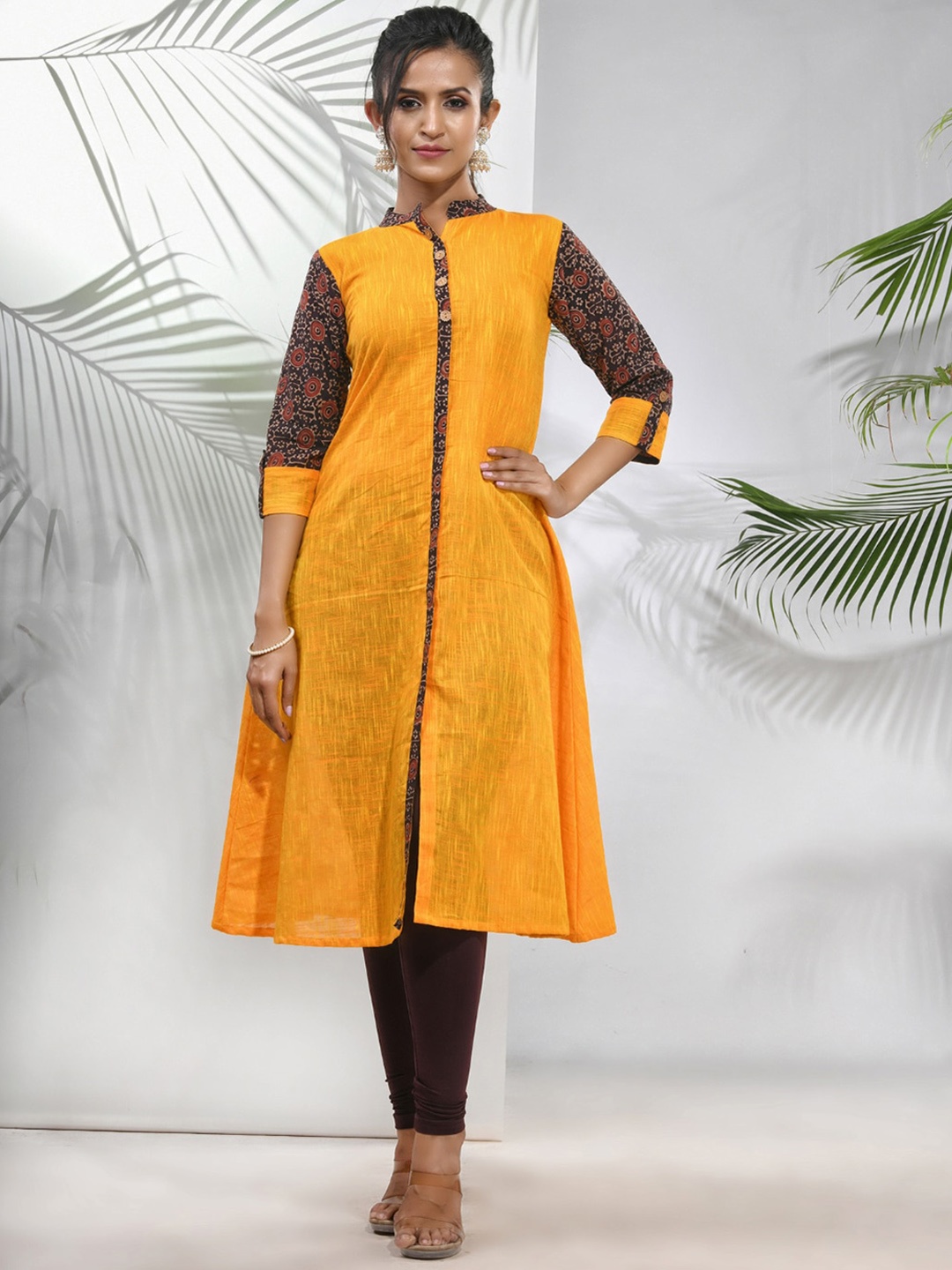 

Charukriti Cotton Thread Work Mandarin Collar Three-Quarter Sleeves A-Line Kurta, Yellow