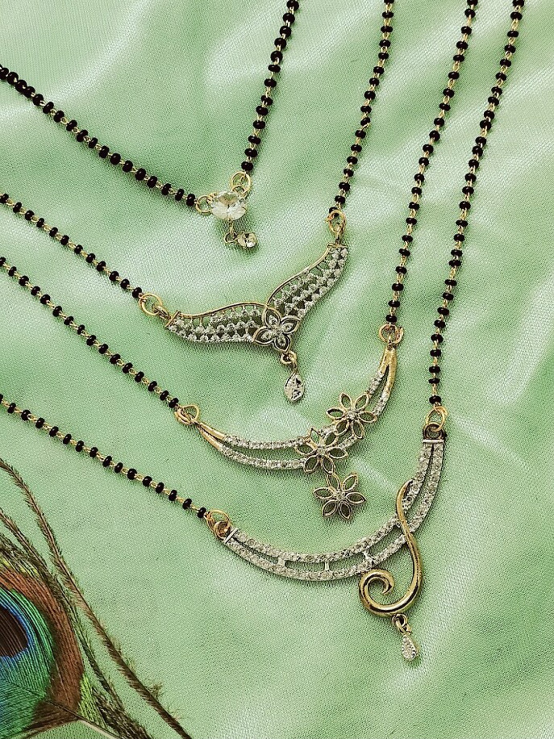 

FEMMIBELLA Set of 4 Gold-Plated American Diamond Studded Mangalsutras