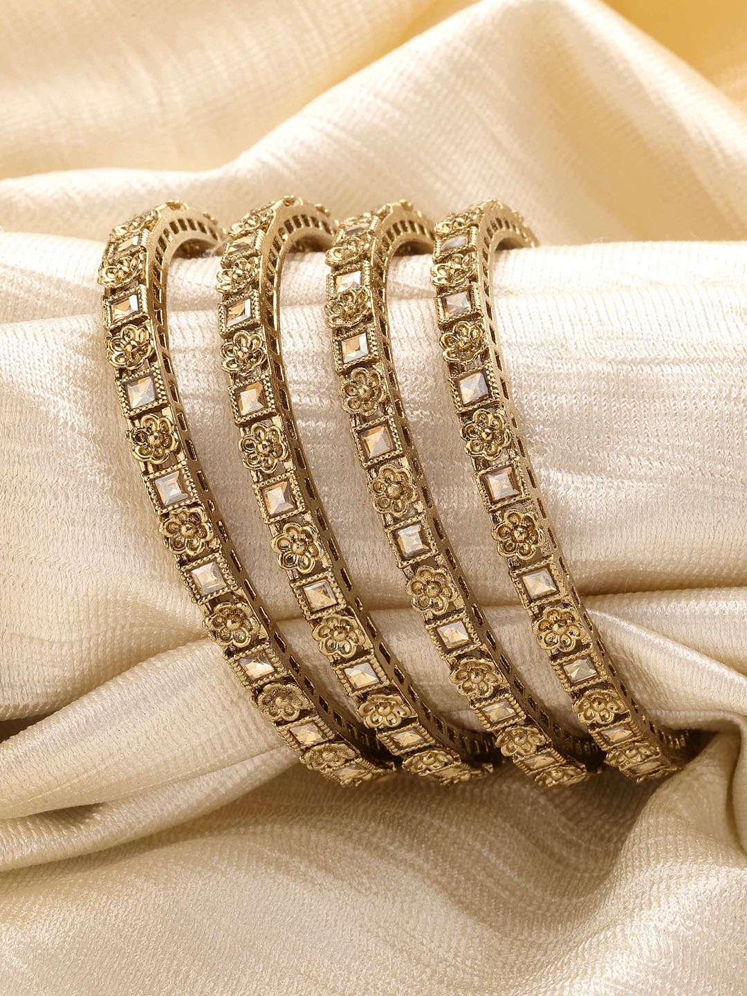 

KARATCART Set of 4 Gold-Plated Kundan-Studded Antique Bangles