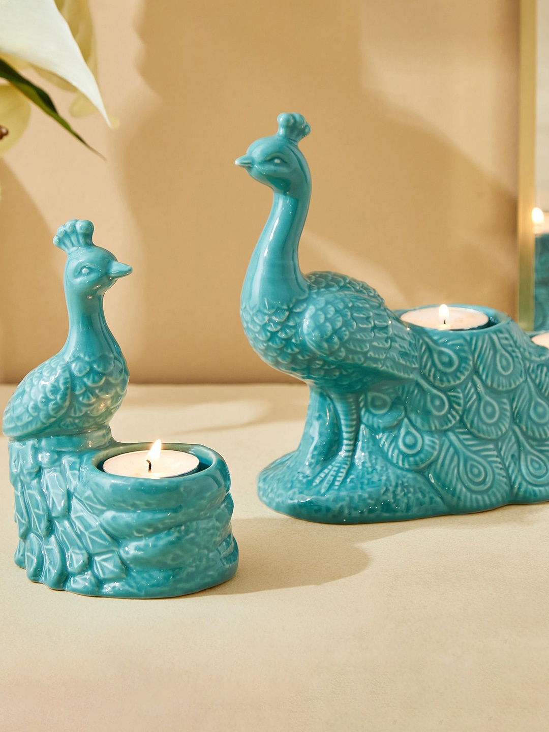 

Home Centre Teal Ceramic Peacock T-Light Holder