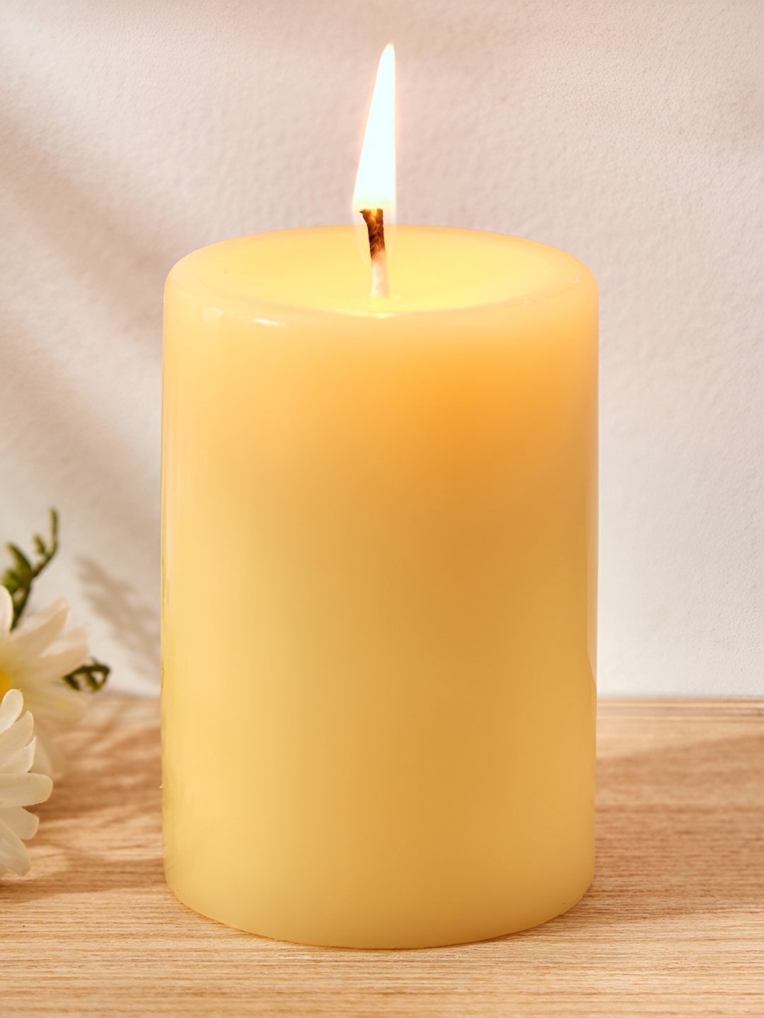 

Home Centre Yellow Lemon Grass Scented Pillar Candle