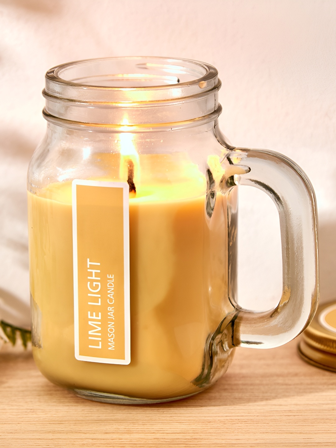 

Home Centre Yellow Lemongrass Scented Jar Candle