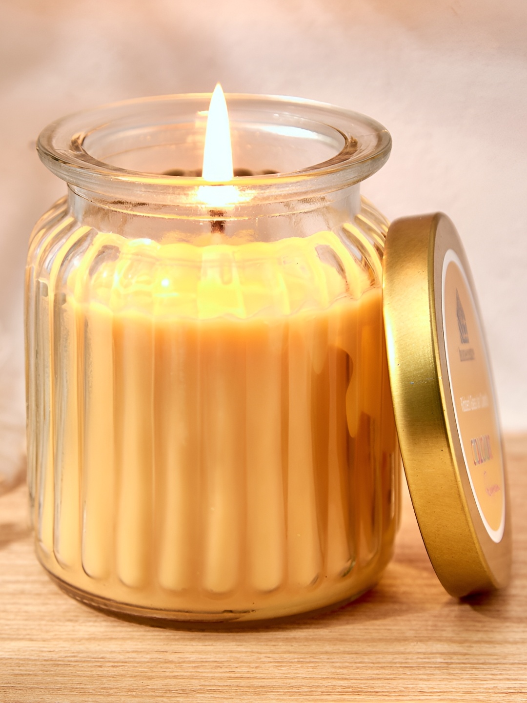 

Home Centre Yellow Lemon Grass Scented Ribbed Jar Candle