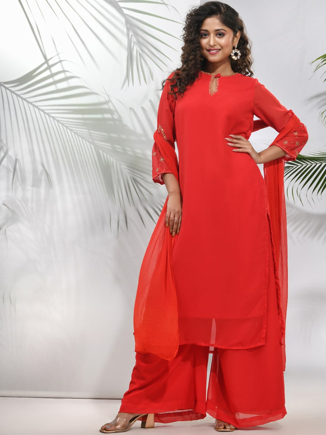 

Charukriti Keyhole Neck Regular Beads And Stones Kurta With Palazzos & Dupatta, Red