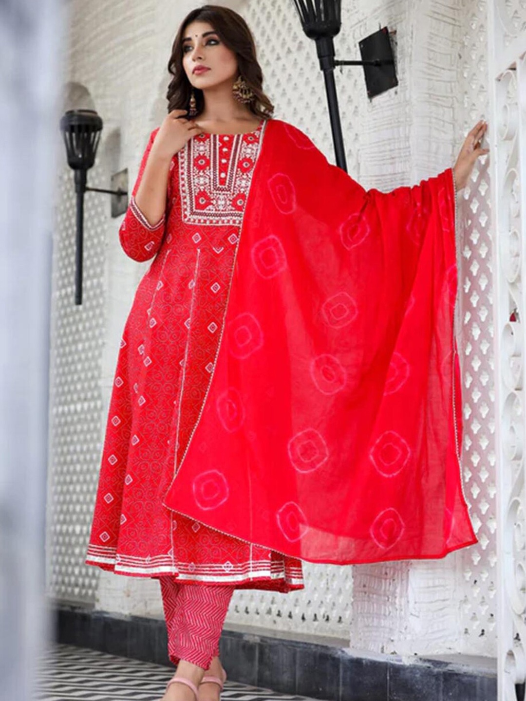 

ARAVALII Bandhani Printed Round Neck Three-Quarter Sleeves Thread Work Anarkali Kurta Sets, Red