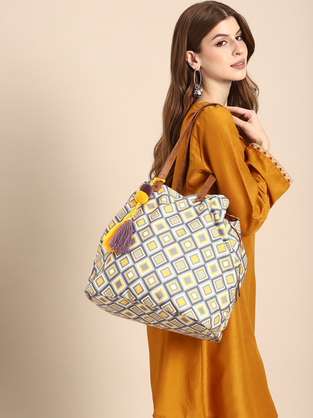 

Sangria Geometric Printed Oversized Structured Tote Bag with Tasselled, Multi