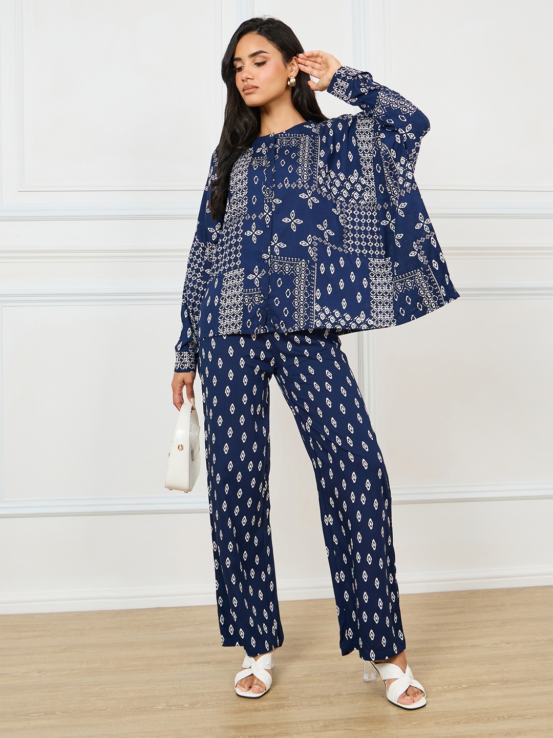 

Styli Printed Relaxed Fit Round Neck Top & Flared Trouser Co-Ords, Blue