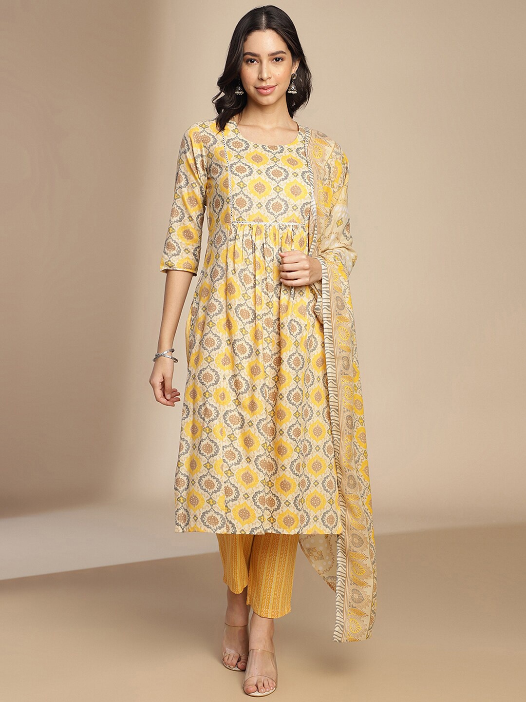 

SKYLEE Round Neck Ethnic Motifs Printed Panelled Kurta Set, Beige
