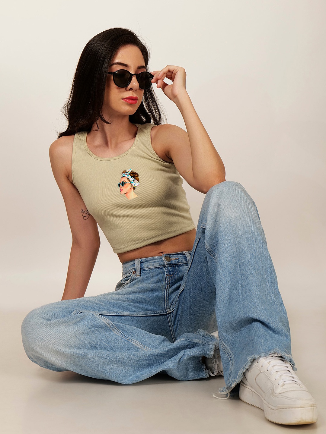 

Fashion And Youth Graphic Printed Sleeveless Fitted Crop Top, Beige