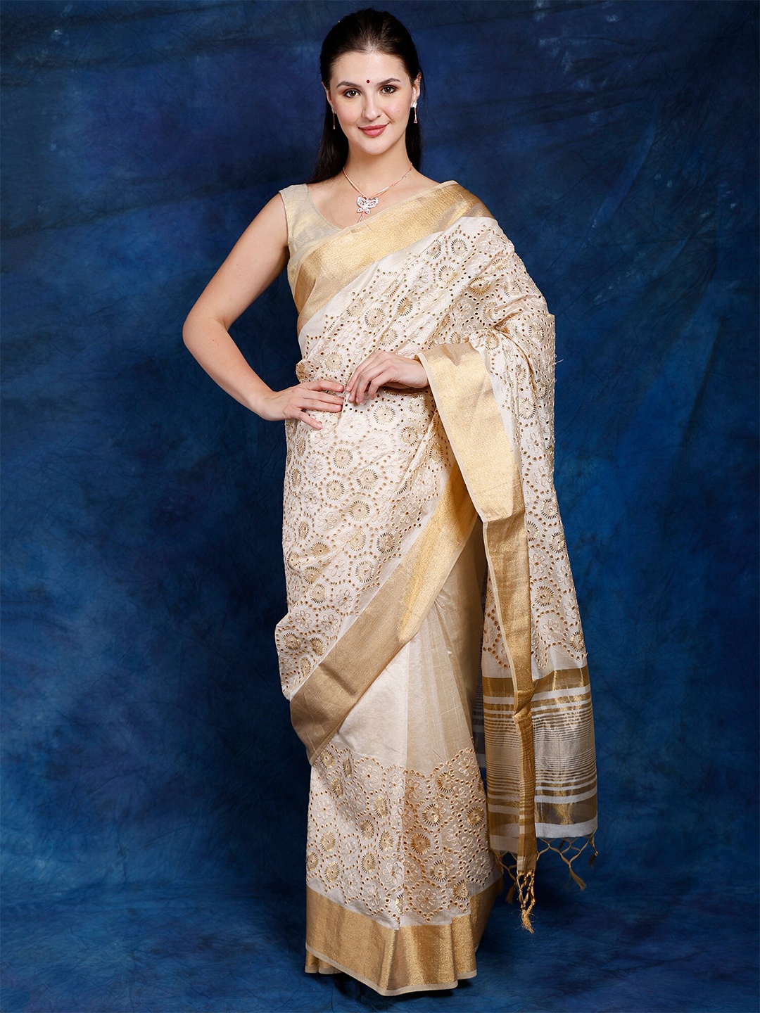 

Exotic India Alabaster Gleam Art Silk Hakoba Embroidered Saree with Golden Border, Cream