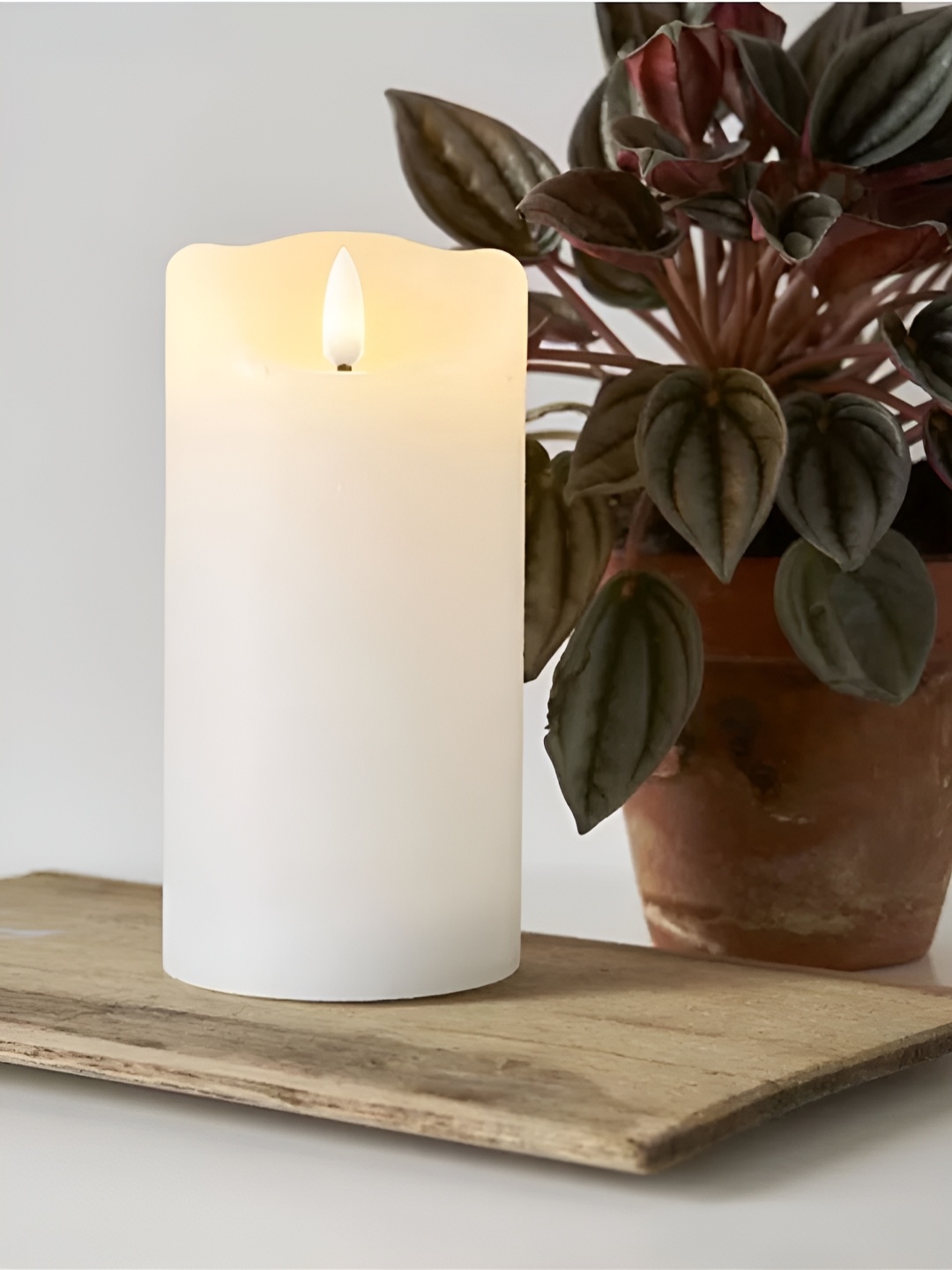 

DecorTwist Artificial Battery Operated Moving Flame Pillar Candle, White