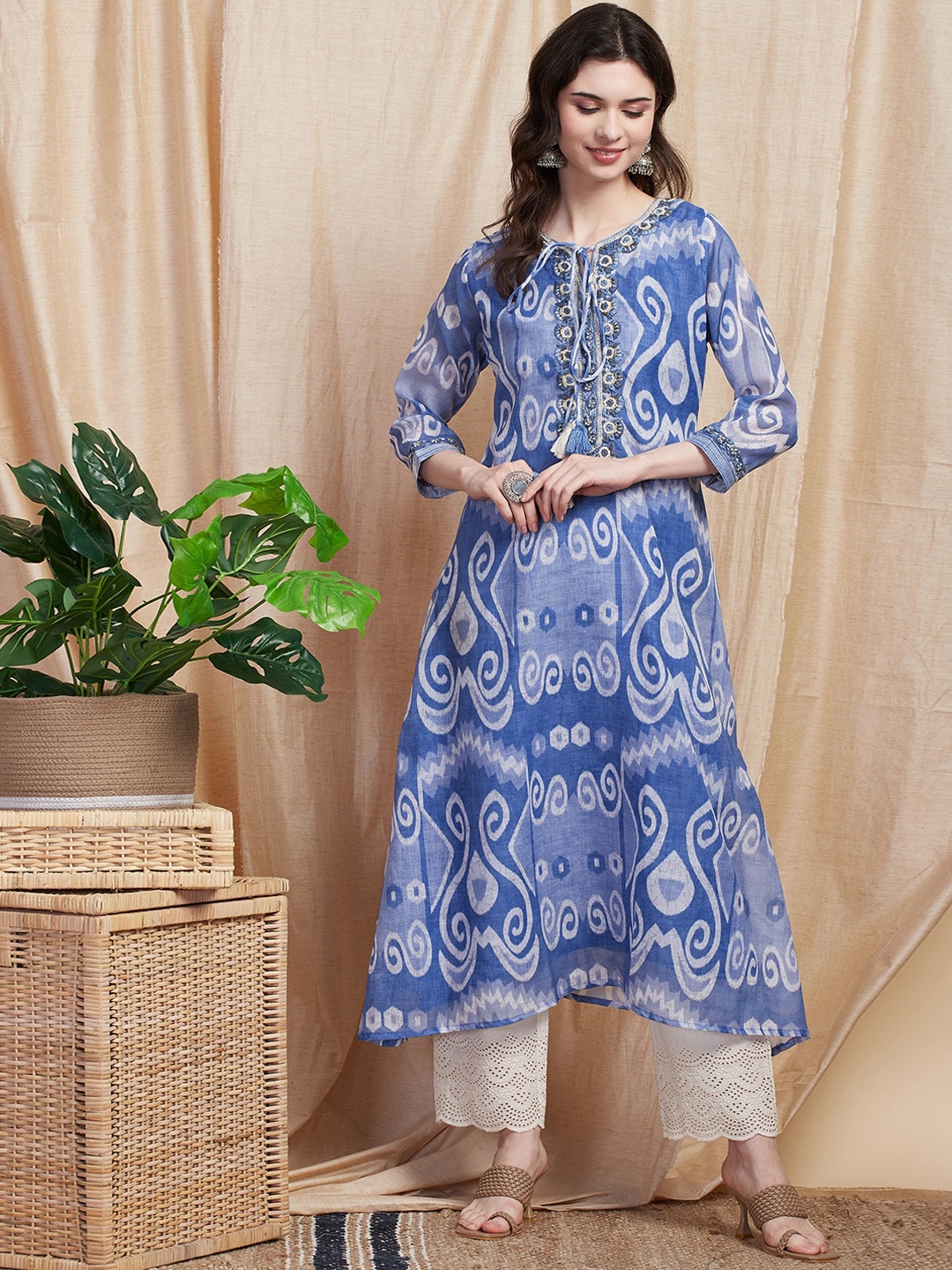 

FASHOR Ethnic Motifs Printed Tie-Up Neck Thread Work Cotton A-Line Kurta, Blue