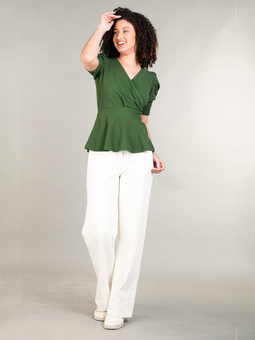 

The Roadster Lifestyle Co. Green V-Neck Peplum Top