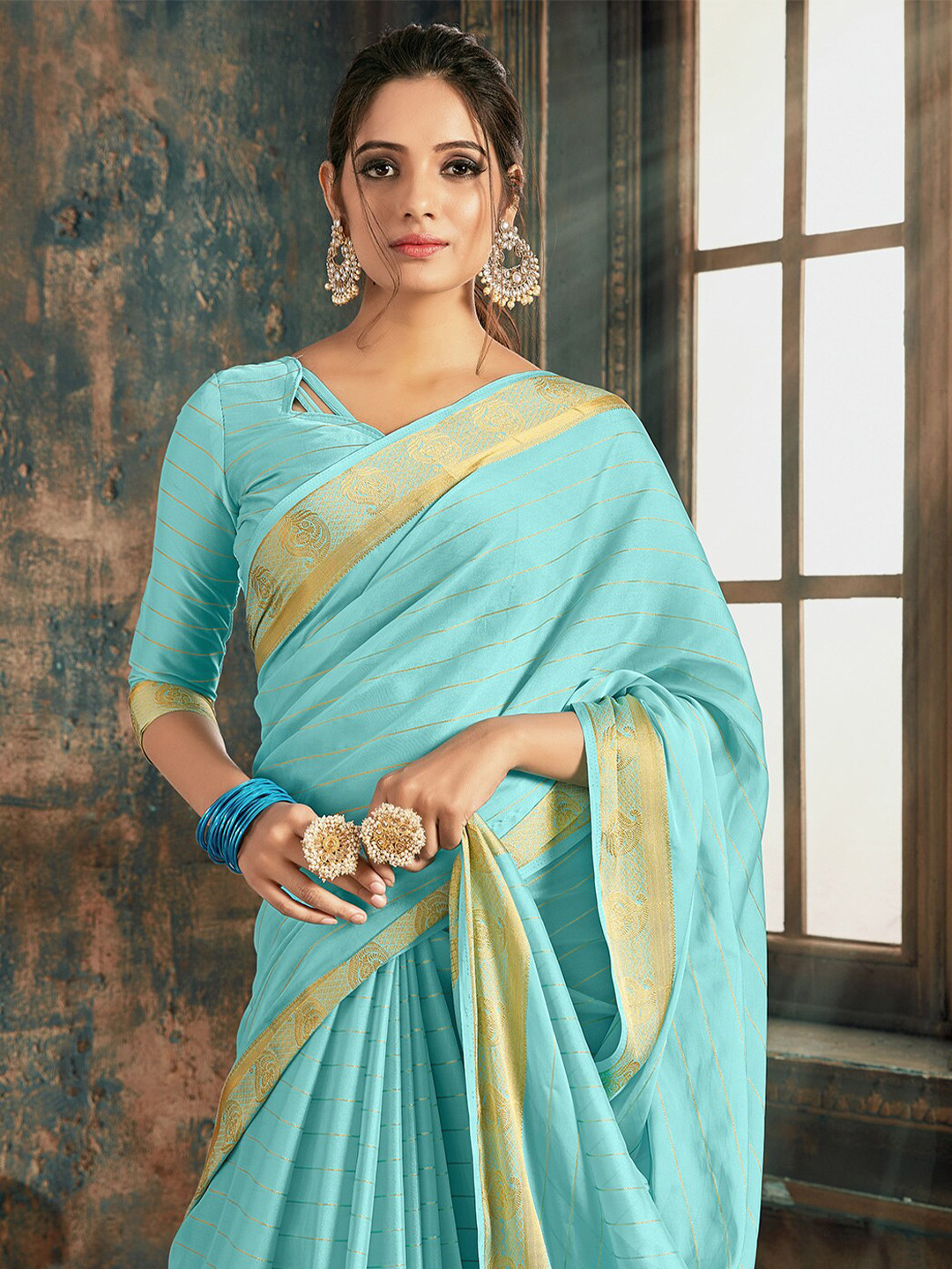 

Mitera Blue Woven Design Zari Saree