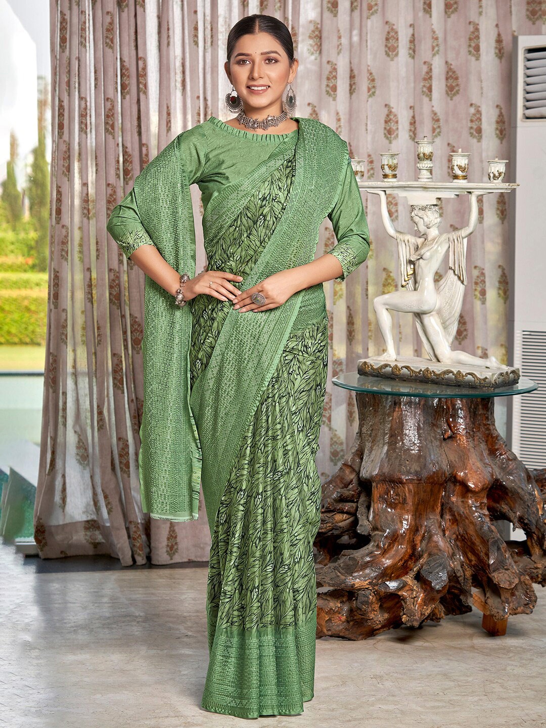 

Vishudh Green Floral Printed Zari Embroidered Chinon Saree
