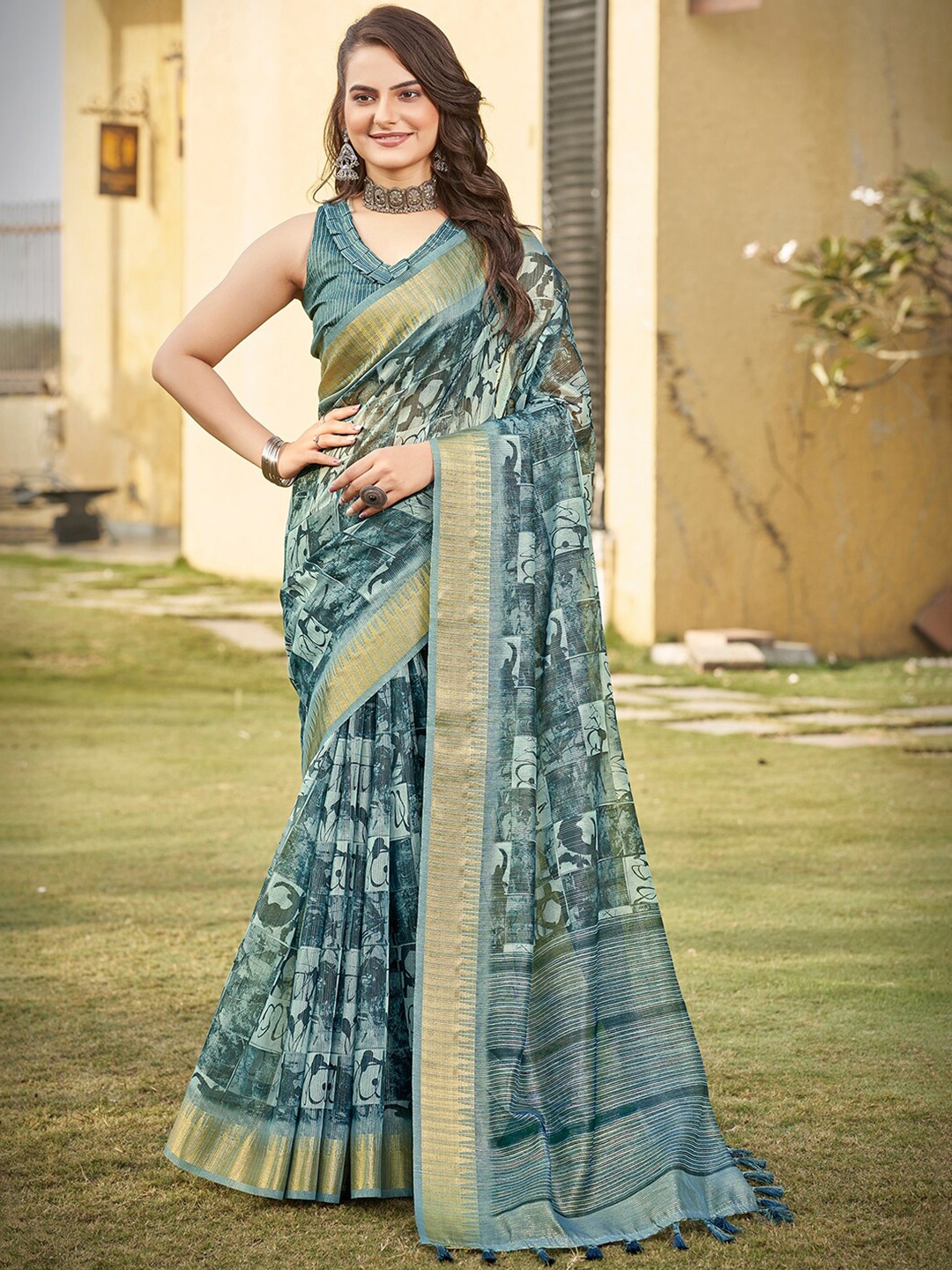 

Vishudh Green & Gold Toned Zari Organza Saree