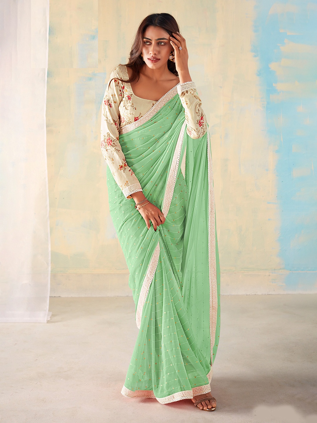 

Mitera Green & Cream Embellished Embroidered Sequinned Saree