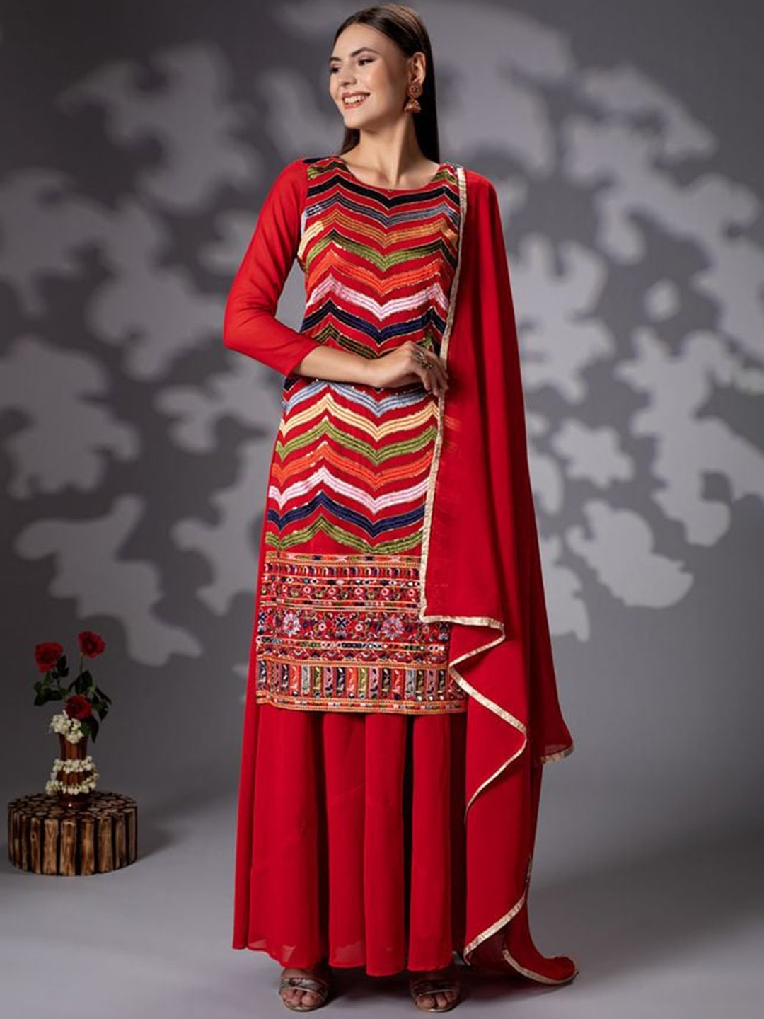 

Rujave Ethnic Motifs Embroidered Pleated Mirror Work Kurta with Sharara & With Dupatta, Red