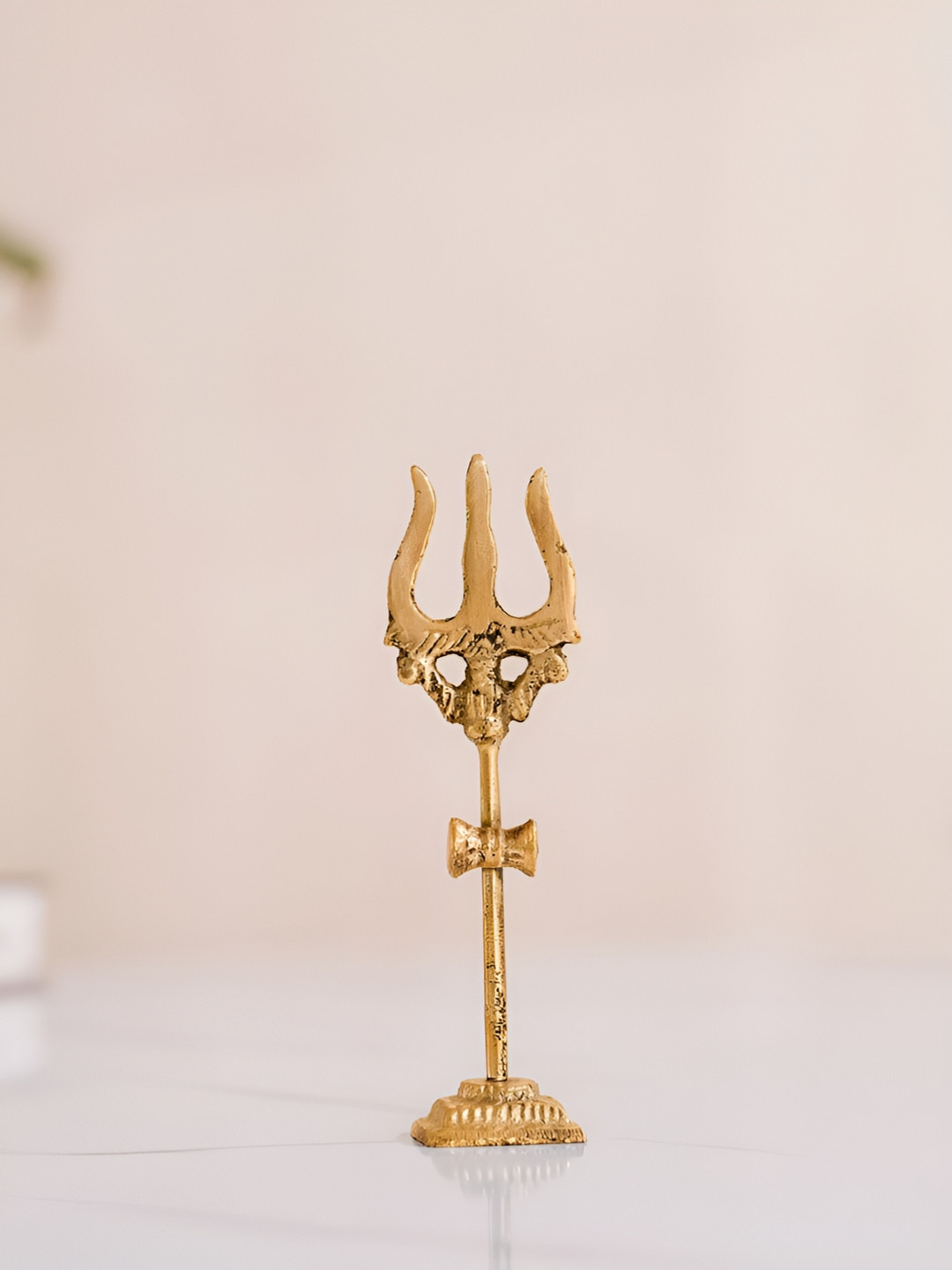 

DecorTwist Gold-Toned Trishul Religious Trishul Showpiece