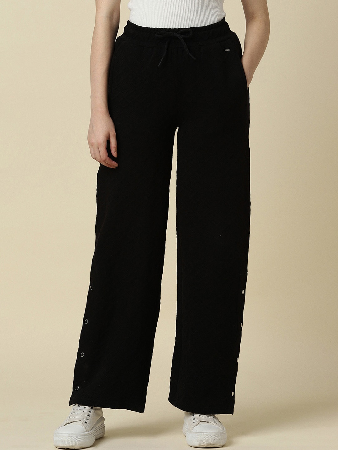 

Allen Solly Woman Textured Self Design Mid Rise Trousers, Black