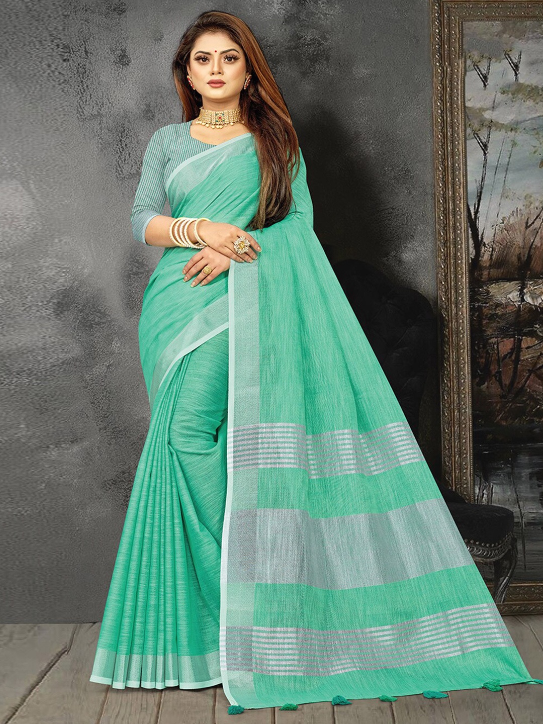 

Ishin Turquoise Blue Striped Zari Saree