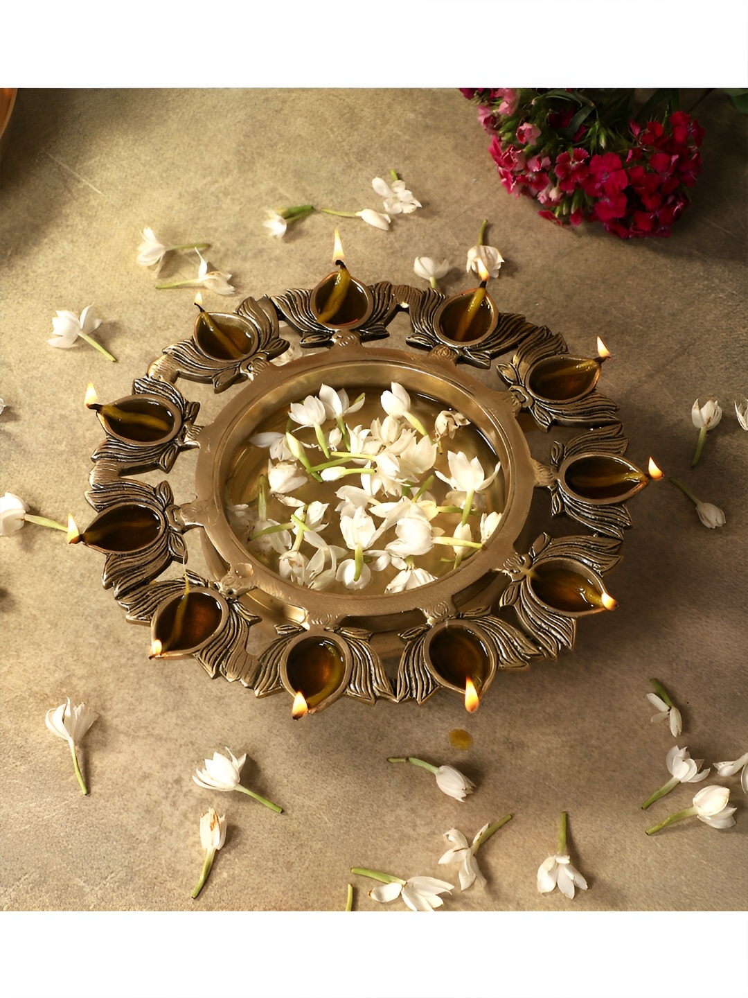 

Two Moustaches Brown Brass Urli Bowl With Diyas