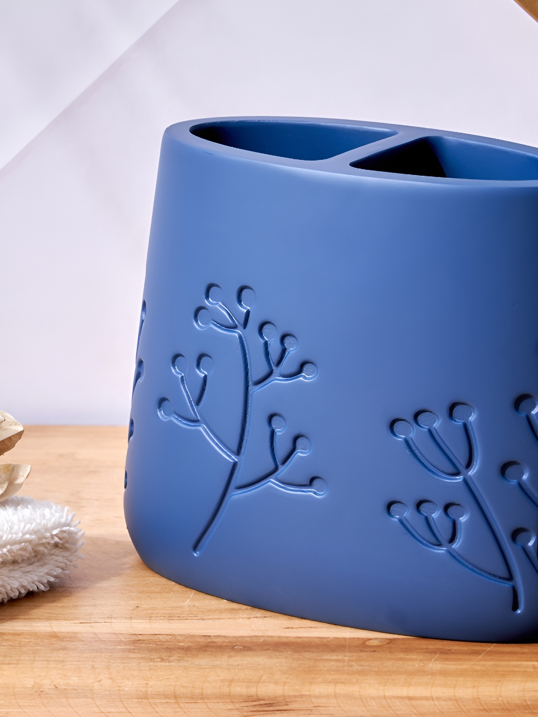 

Home Centre Blue Floral Textured Tooth Brush Holder