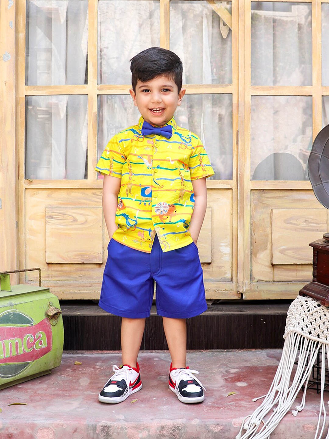 

Whistle & Hops Boys Graphic Printed Pure Cotton Shirt with Shorts & Bow, Yellow