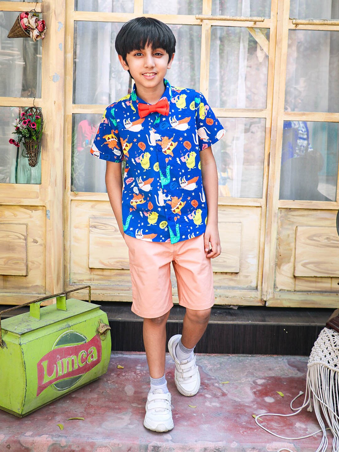 

Whistle & Hops Boys Graphic Printed Pure Cotton Shirt with Shorts & Bow, Blue