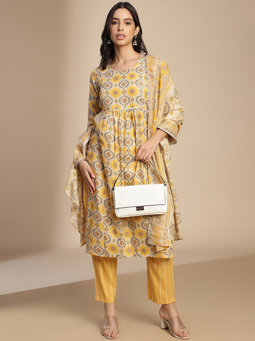 

Saanjh Yellow Ethnic Motifs Printed Round Neck A-Line Kurta With Trousers & Dupatta